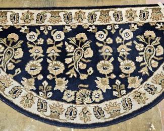 Large half-round hearth or entry-way rug