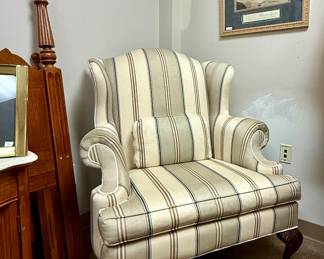 Traditional wingback armchair with striking ball-and-claw feet