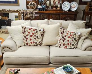 Comfy, neutral sofa with nailhead detail