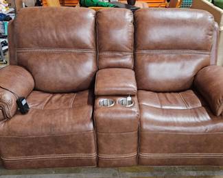 Reclining theater-style leather sofa for two