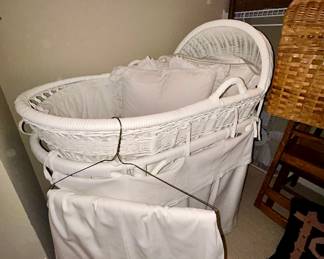 Vintage white wicker bassinet with skirt and bedding