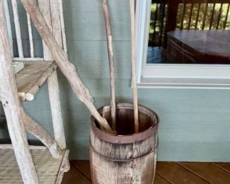 Wooden barrel with rustic walking sticks and canes