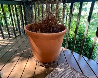 Large terracotta planter pot with plant stand