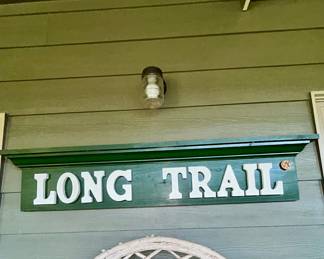 Green wooden 'Long Trail' carved sign