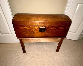Antique dome-top wooden trunk on custom stand