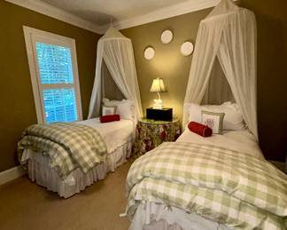 Twin bed pair with canopy netting, checked bedding - $150 ea