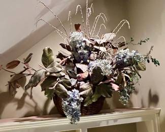 Large silk floral arrangement in woven basket