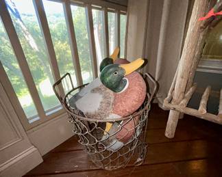 Wire chicken-wire basket with carved wooden decoy ducks