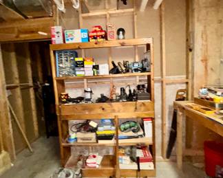 Wooden shelving unit full of tools, hardware, supplies