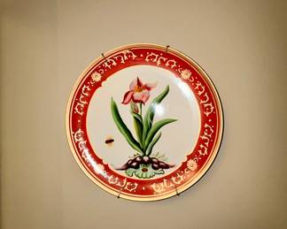 Decorative botanical wall plate, red border, floral design