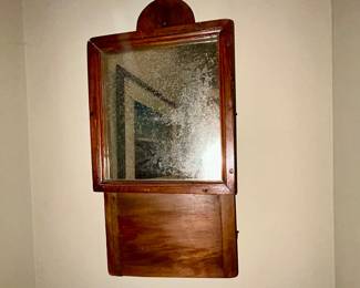 Antique mahogany wall mirror, shelf back, worn glass