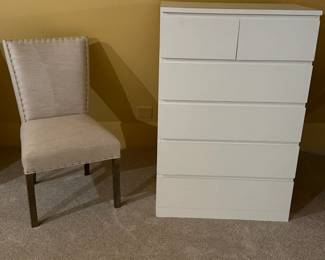 dresser and armless upholstered chair