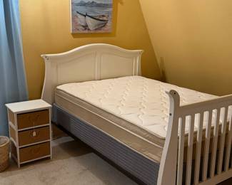 full sized bed, mattress set, art, side table