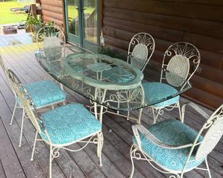 Glass topped patio set with 6 chairs
