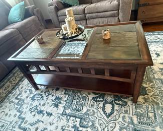 Coffee table with glass and stone top.