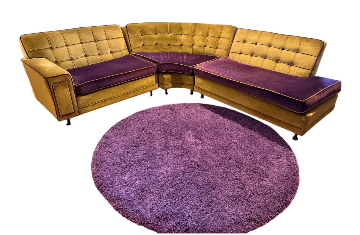 1960’s striking vintage mid-century modern modular sectional sofa upholstered in mustard yellow and deep purple velvet, paired with a matching round shag rug.
