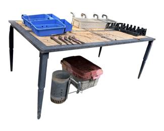 sturdy utility table features distinctive fluted legs and a large, flat surface