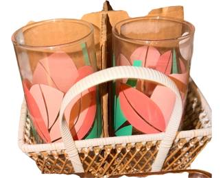 La Rue is the brand behind these popular vintage glassware pieces, which feature a distinct, stylized pink tulip and green leaf design.Produced around the 1980s or 1990s, this particular retro floral pattern has become highly sought-after by collectors of Mid-Century Modern and post-modern kitchen aesthetic styles With carrier