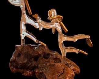 hand-blown clear glass with 22K gold flake or trim accents vintage hand-blown art glass sculpture featuring two figures mounted on a natural wood burl base