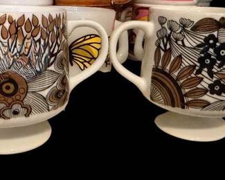 ffee mug featuring a groovy, stylized floral pattern.