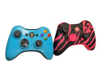 custom or modified Microsoft Xbox 360 wireless controllers featuring a solid light blue design and a pink-and-black zebra print shell