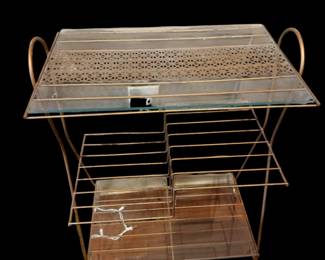 vintage mid-century modern brass-toned metal and glass record player or magazine stand with tiered wire storage racks 1950-60’s