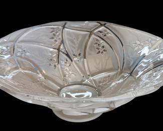 a vintage pressed or cut clear crystal glass footed bowl, reminiscent of mid-century or Art Deco decorative glassware designs with molded floral and panel details By Consolidated Line 700