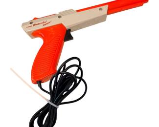 an original 1985 orange Nintendo NES Zapper Light Gun designed for shooting games