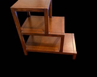 multi-tiered wooden step stand or tiered plant stand with a warm brown finish