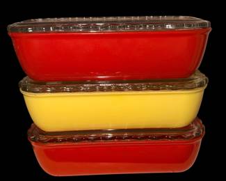 vintage Jeannette Glass Company stacked rectangular refrigerator dishes featuring fired-on red and yellow colors with clear, scalloped/ruffled glass lids