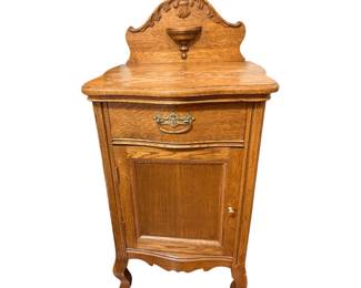 vintage oak nightstand with a carved backsplash, a single drawer, and a lower cabinet door