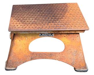One of my favorite things! vintage railroad conductor's passenger boarding step stool, manufactured by the Morton Manufacturing Company out of Chicago./Originally built during the mid-20th century, these heavy-duty steel stools were used by conductors to help passengers safely transition while boarding and exiting train cars. They are famous for their unique, flared-apron silhouette, distinctive oval or circular cutouts, and perforated anti-slip safety "Kass Safety Tread" tops.