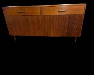 1960s mid-century modern walnut credenza by Ramseur Furniture, featuring distinctive reeded cabinet doors and minimalist wooden pulls