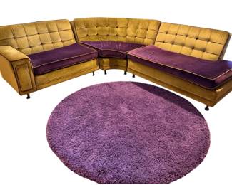 1960’s striking vintage mid-century modern modular sectional sofa upholstered in mustard yellow and deep purple velvet, paired with a matching round shag rug.