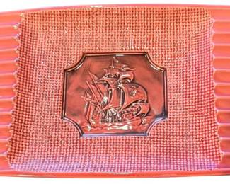 This is a vintage ashtray distributed by Royal Sealy, an American importing company that sourced high-quality porcelain and pottery from Japan/A prominent embossed central emblem featuring a nautical schooner/galleon sailing ship. The textured perimeter displays a waffle-weave pattern flanked by ribbed or corrugated side channels/These dishes were typically produced as decorative trinket dishes, vanity catch-alls, or ashtrays during the 1950s and 1960s