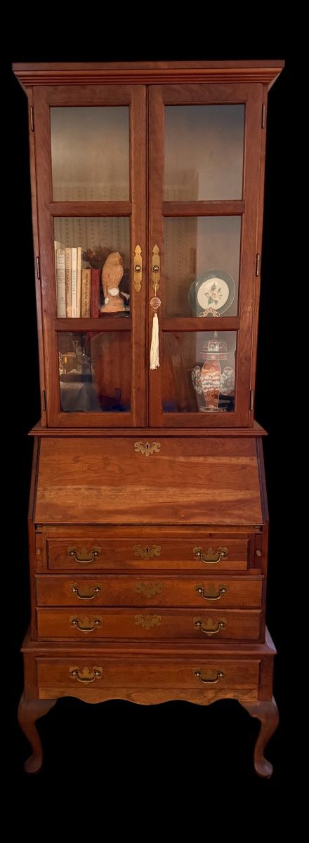 vintage Queen Anne-style slant-front secretary desk with a glass-front bookcase hutch