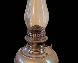an antique Rayo center-draft kerosene oil lamp, typically manufactured by the Bradley & Hubbard Manufacturing Company for the Standard Oil Company between the late 1890s and the 1920s.