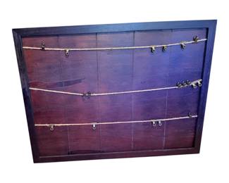 This is a rustic dark wood picture clip frame and photo display board featuring multiple rows of twine string with small metal and binder clips for hanging photos, notes, or artwork.