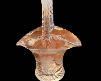 vintage Westmoreland glass basket from the 1930s featuring an etched floral design, a ruffled rim, and an ornate, textured handle