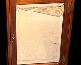 This stunning piece is an antique sheet music cabinet, typically dating from the late Victorian to Edwardian era (circa 1890–1915).  Beveled mirror
