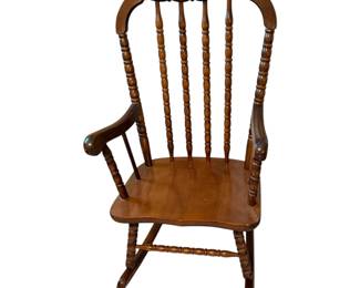 This is a child’s Jenny Lind-style spindle rocker. 