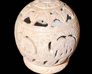 a hand-carved soapstone tealight candle holder and incense cone burner featuring traditional elephant and floral jali (openwork) designs