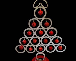 This is a handmade Christmas tree creation by local artists Woods and Wife. It stands about 3 feet tall.