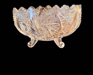 vintage clear cut crystal footed bowl featuring an intricate pinwheel and starburst pattern with a scalloped, sawtooth rim