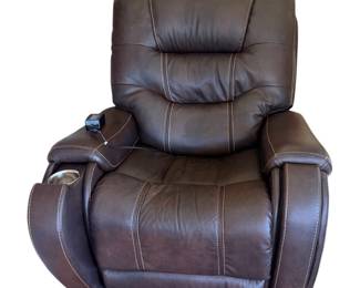 This is a a brown power lift/reclining armchair featuring contrast stitching, built-in side cup holders, and an attached remote control. 