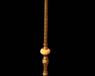 vintage ornate brass floor lamp featuring an intricate cast metal base with decorative feet and a neutral-toned rectangular fabric shade
