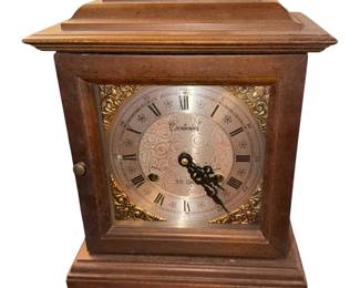 Overview        This object is a Vintage Centurion 35-Day Mantel Clock, featuring a classic key-wound mechanical movement housed in a bracket-style wooden case. Known for their hourly and half-hourly chimes, these clocks were predominantly produced in South Korea during the late 20th century (roughly the 1970s through the 1980s)