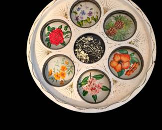 a vintage 1960s–1970s Florida souvenir round metal serving tray featuring a central map of Florida and six circular indents decorated with floral designs