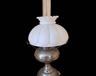 vintage metal-base oil or kerosene table lamp featuring a fluted milk glass shade and a clear glass chimney