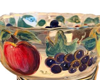 This is a heavy glass bowl with painted fruit motif